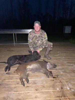 Kevin with a couple of nice meat hogs!!