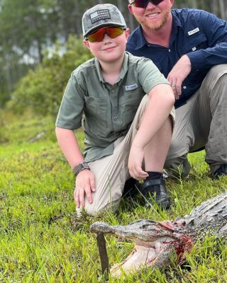 8 year old Jimmy taking his first gator by fighting him on a...