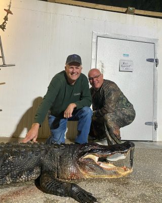 Brian with a beast of an alligator on this Public Waters Hun...