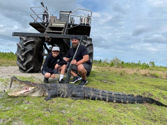 Shane and son with a nice gator hunt while on Vacation in Or...