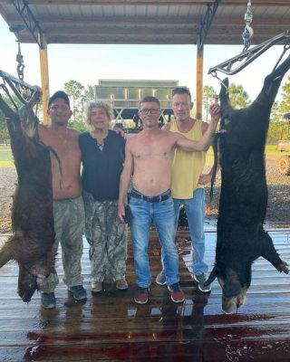 Travis and company with a couple nice hogs.