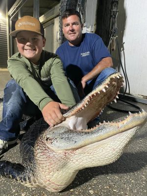 Justin, Calvin and 13 year old Byron with two nice gators.