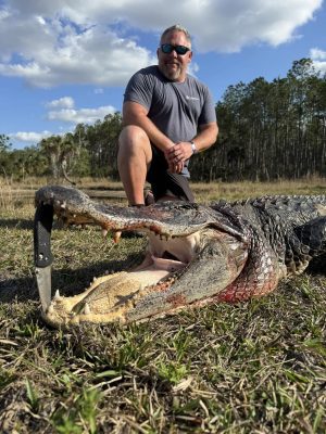 Kevin and Mathew taking a short break from their work conference to alligator hu...