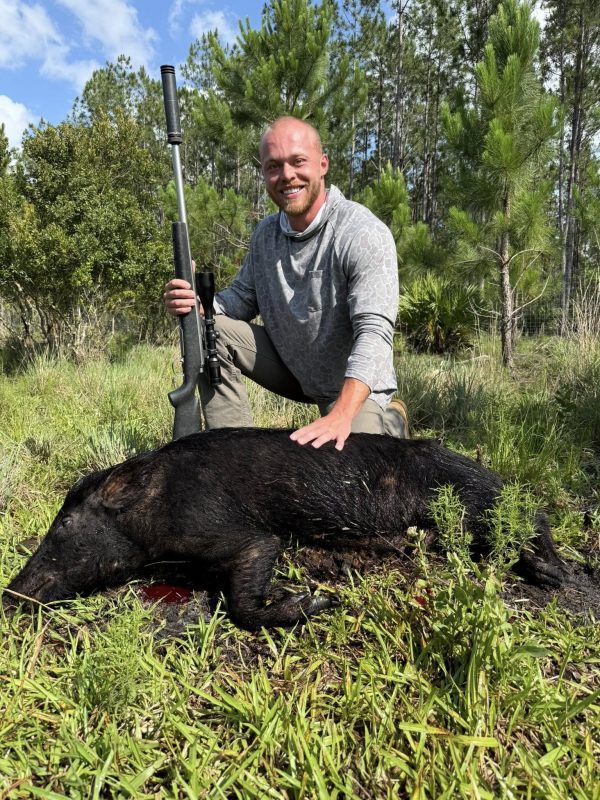 Jared and Zack with two impressive meat hogs at P4 Ranch